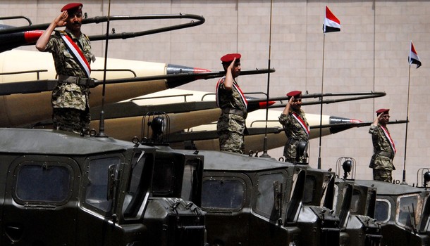 Yemeni soldiers standing on missile launchers salute during a military parade in Sanaa on May 21, 2009