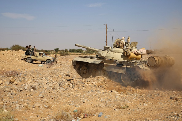 Armed Yemeni tribesmen from the Popular Resistance Committees, supporting forces loyal to Yemen's Saudi-backed President Abedrabbo Mansour Hadi, hold a position in the area of Sirwah, west of Marib city, on December 18, 2015. A Yemen ceasefire appeared to have collapsed as government forces captured two towns from rebels and an allied Arab coalition accused insurgents of escalating the conflict by firing ballistic missiles. AFP PHOTO / ABDULLAH AL-QADRY / AFP / ABDULLAH AL-QADRY (Photo credit should read ABDULLAH AL-QADRY/AFP/Getty Images)